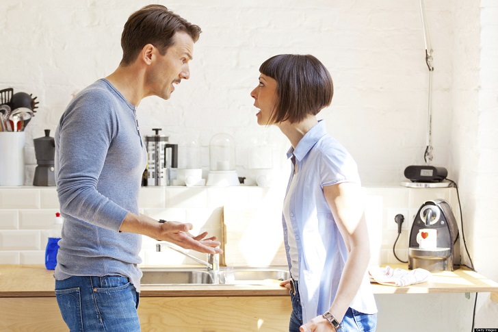 Couple having a discussion in the kitchen